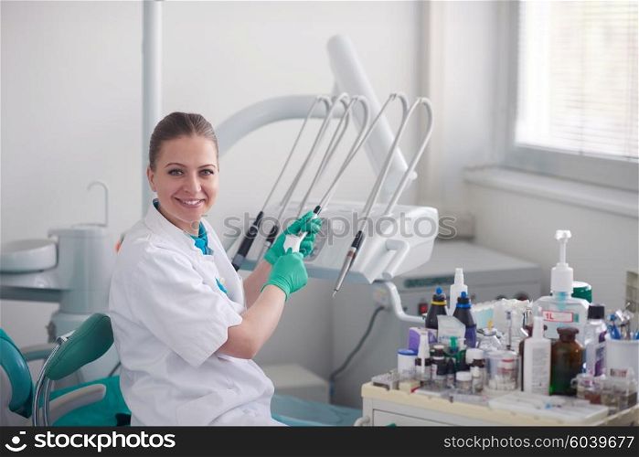 portrait of a dentist smiling at the camera
