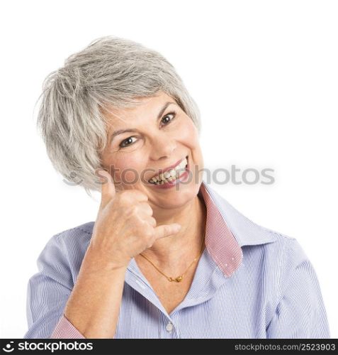 Portrait of a elderly woman making a phone call gesture