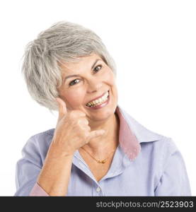 Portrait of a elderly woman making a phone call gesture