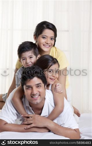 Portrait of a family on bed