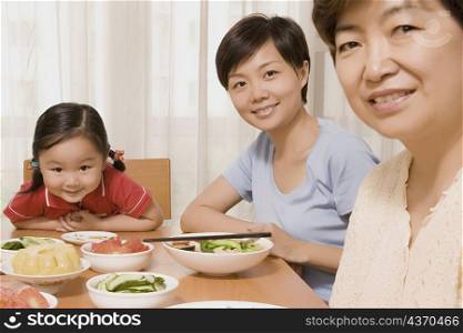 Portrait of a family sitting at a dining table