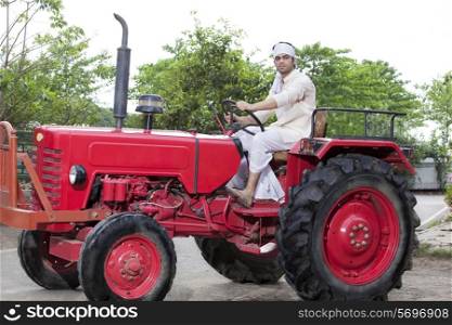 Portrait of a farmer sitting on a tractor