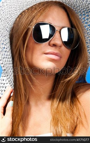 portrait of a fashionable long haired woman wearing hat