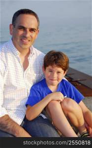 Portrait of a father and son on a pier