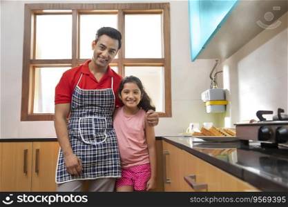 Portrait of a Father with her daughter in the kitchen 