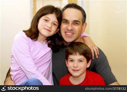 Portrait of a father with two children