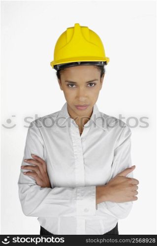 Portrait of a female architect standing with her arms folded