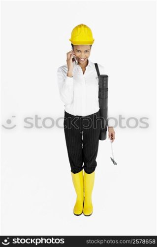 Portrait of a female architect talking on a mobile phone