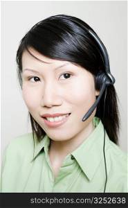 Portrait of a female customer service representative using a headset