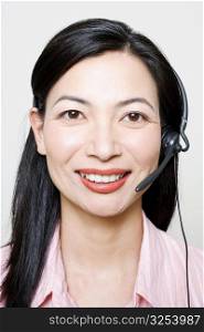 Portrait of a female customer service representative using a headset