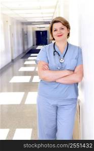 Portrait of a female doctor or nurse in a hospital corridor