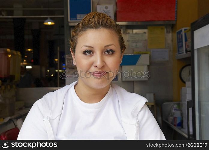 Portrait of a female ice-cream shop owner