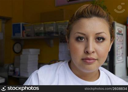 Portrait of a female ice-cream shop owner