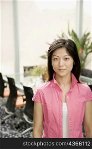 Portrait of a female office worker standing in an office