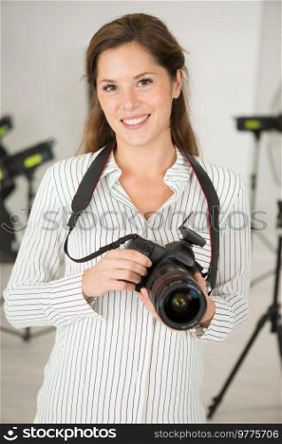 portrait of a female photographer in a studio