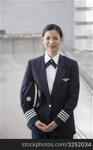 Portrait of a female pilot standing
