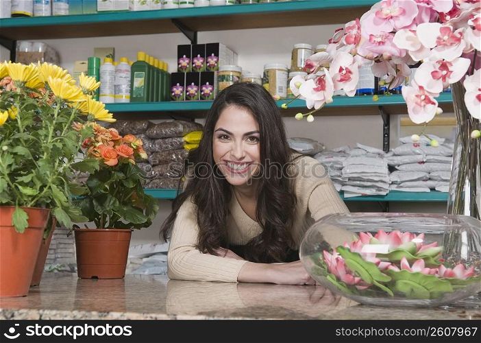Portrait of a female sales clerk smiling in a flower shop