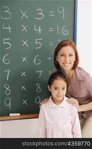 Portrait of a female teacher smiling with her student