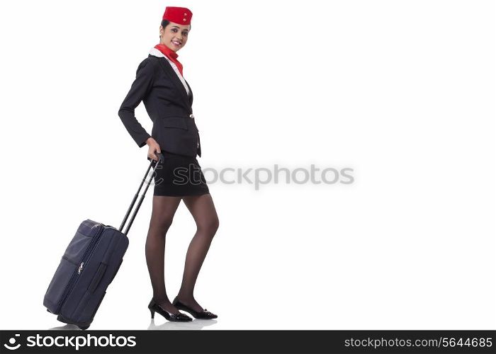 Portrait of a flight attendant with luggage bag isolated over white background