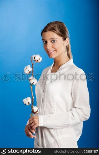 Portrait of a Fresh and Beautiful young woman holding a cotton plant