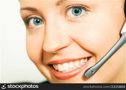 Portrait of a friendly female call center operator