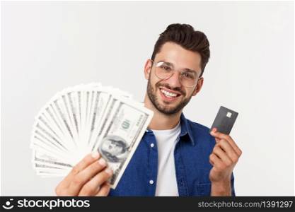 Portrait of a frinedly bearded man holding credit card and showing cash isolated over white background.. Portrait of a frinedly bearded man holding credit card and showing cash isolated over white background