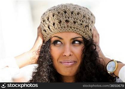 Portrait of a funny black woman wearing a wool cap