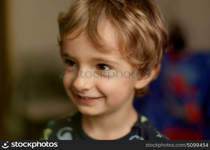 Portrait of a funny child at home smiling