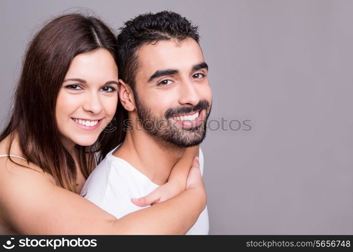 Portrait of a funny love couple hugging each other