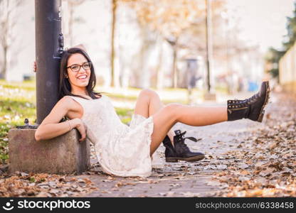 Portrait of a funny woman, model of fashion, with high heels moving her legs