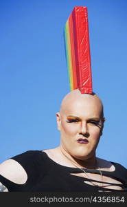 Portrait of a gay man wearing a colorful headdress