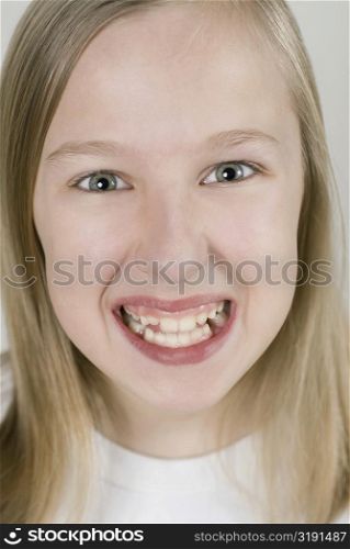 Portrait of a girl clenching her teeth