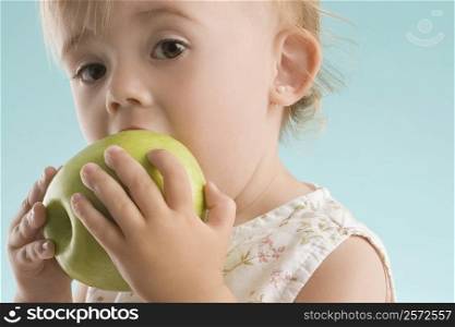 Portrait of a girl eating an apple