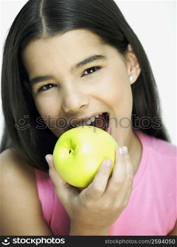 Portrait of a girl eating an apple
