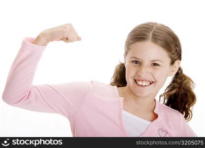 Portrait of a girl flexing her biceps