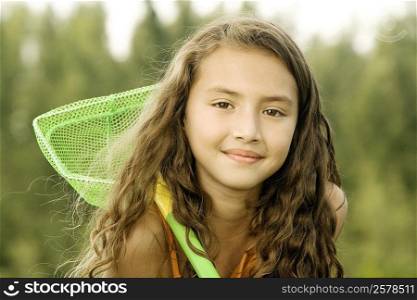 Portrait of a girl holding a butterfly net