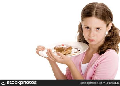 Portrait of a girl holding a donut in a plate