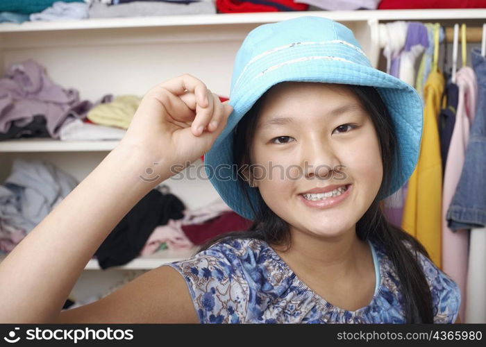 Portrait of a girl holding a hat