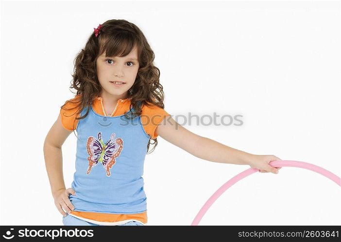Portrait of a girl holding a hula hoop