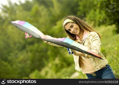 Portrait of a girl holding a kite