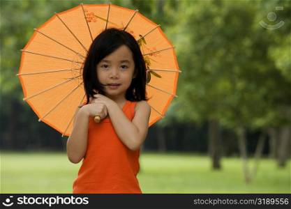 Portrait of a girl holding a parasol
