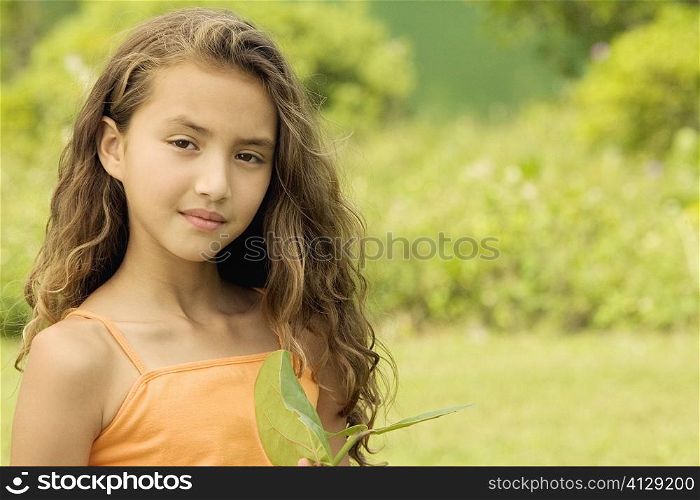 Portrait of a girl holding a stem