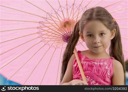 Portrait of a girl holding an umbrella