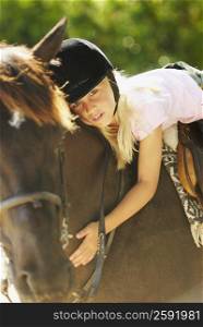 Portrait of a girl horseback riding