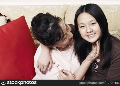 Portrait of a girl hugging her grandmother