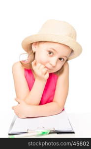 portrait of a girl in a hat with a notebook on a white background isolated