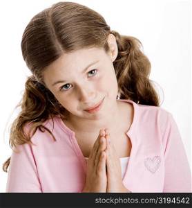 Portrait of a girl in a prayer position