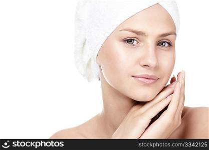 Portrait of a girl in a towel on a white background