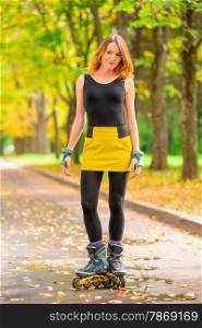 portrait of a girl in a yellow skirt roller skate