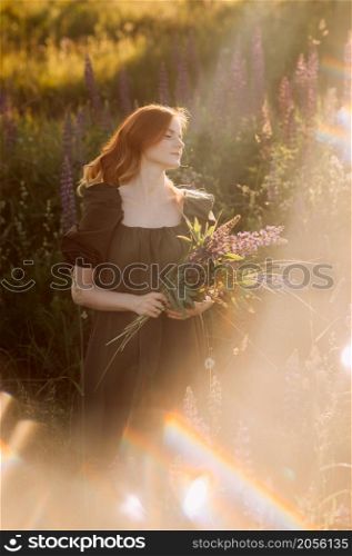 Portrait of a girl in the style of dreams.. A beautiful portrait with the glare of the sun of a girl in a meadow 3281.